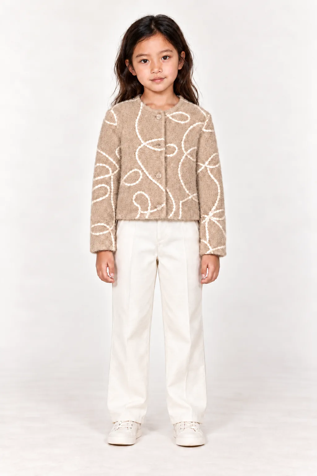 VOLUTE — Veste enfant en laine à motifs en relief, beige pêche, vue de face